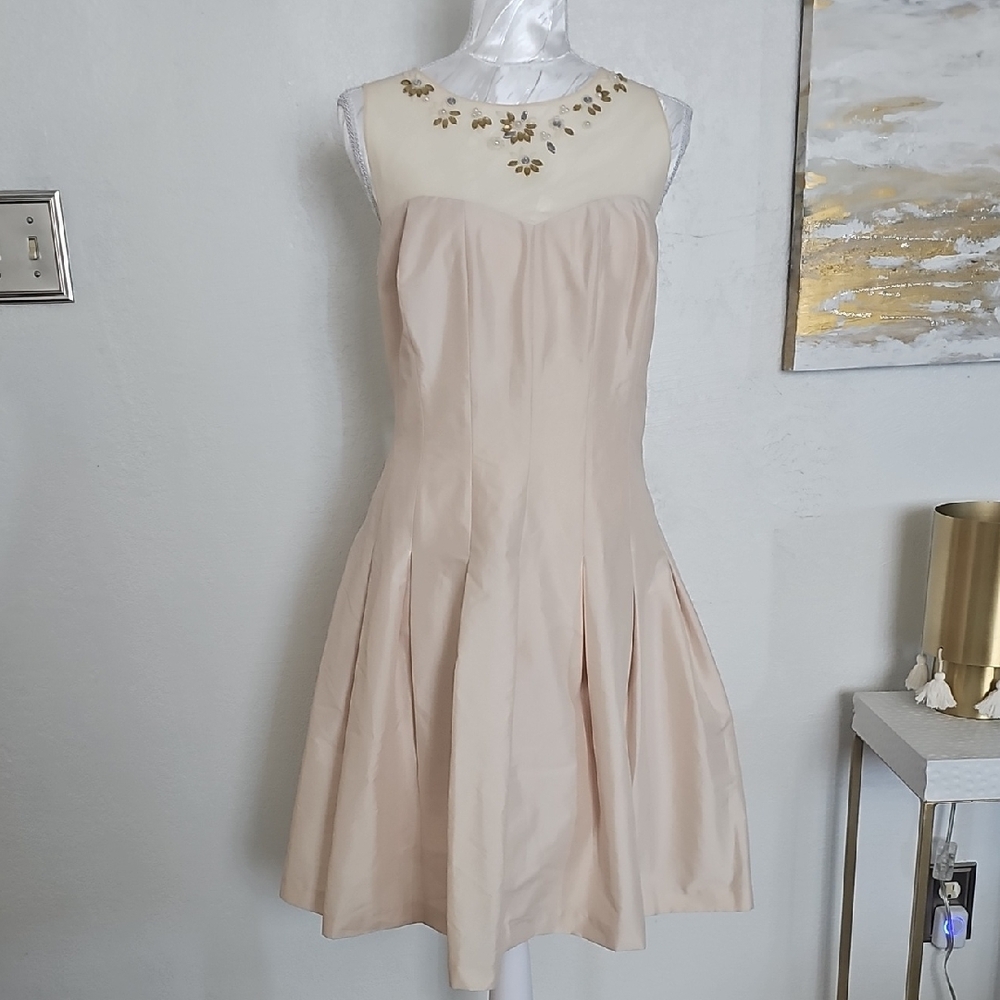 Elegant Cream Dress with Gold Accents